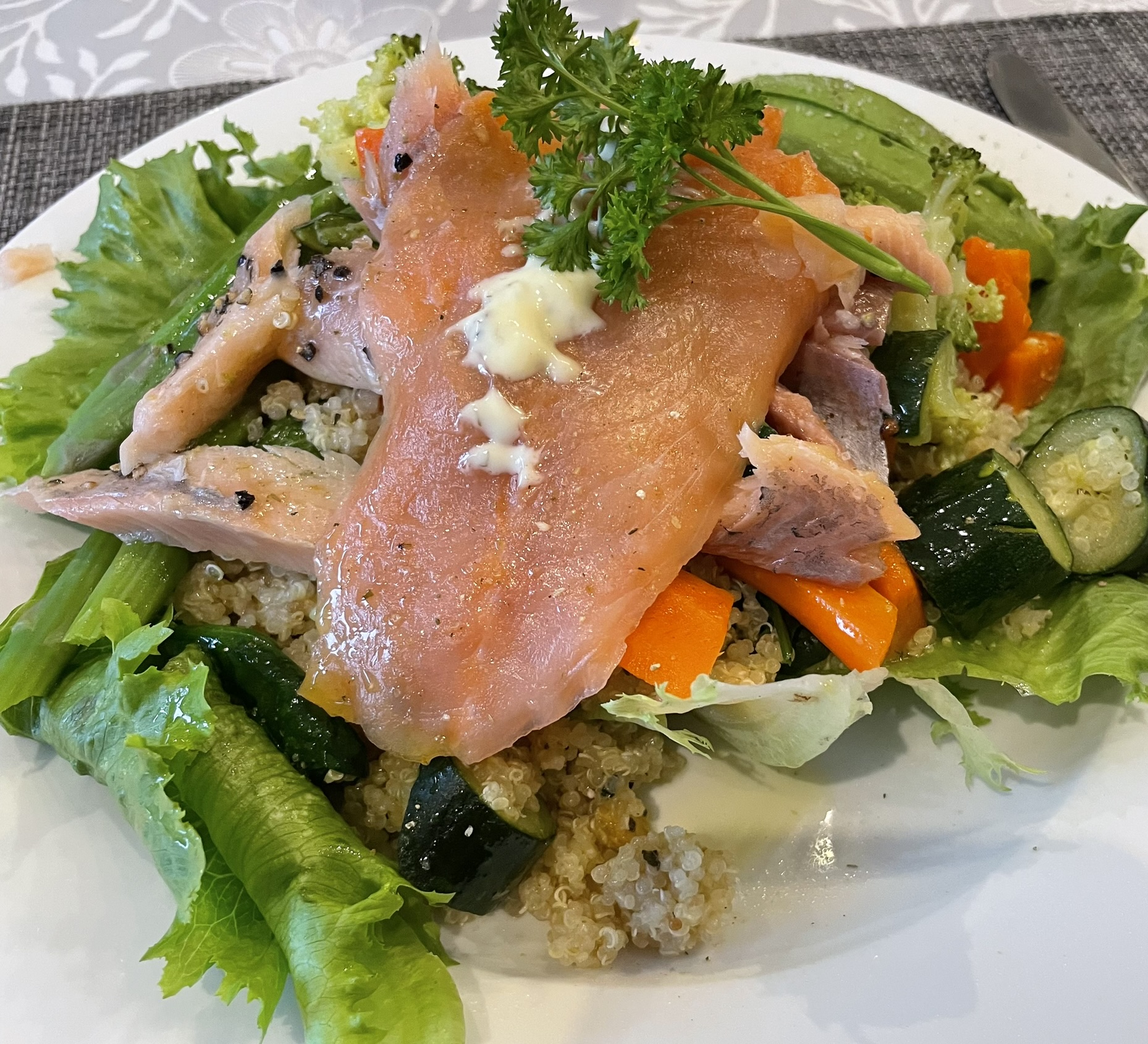 A nourishing meal of salmon, quinoa and colourful fresh vegetables