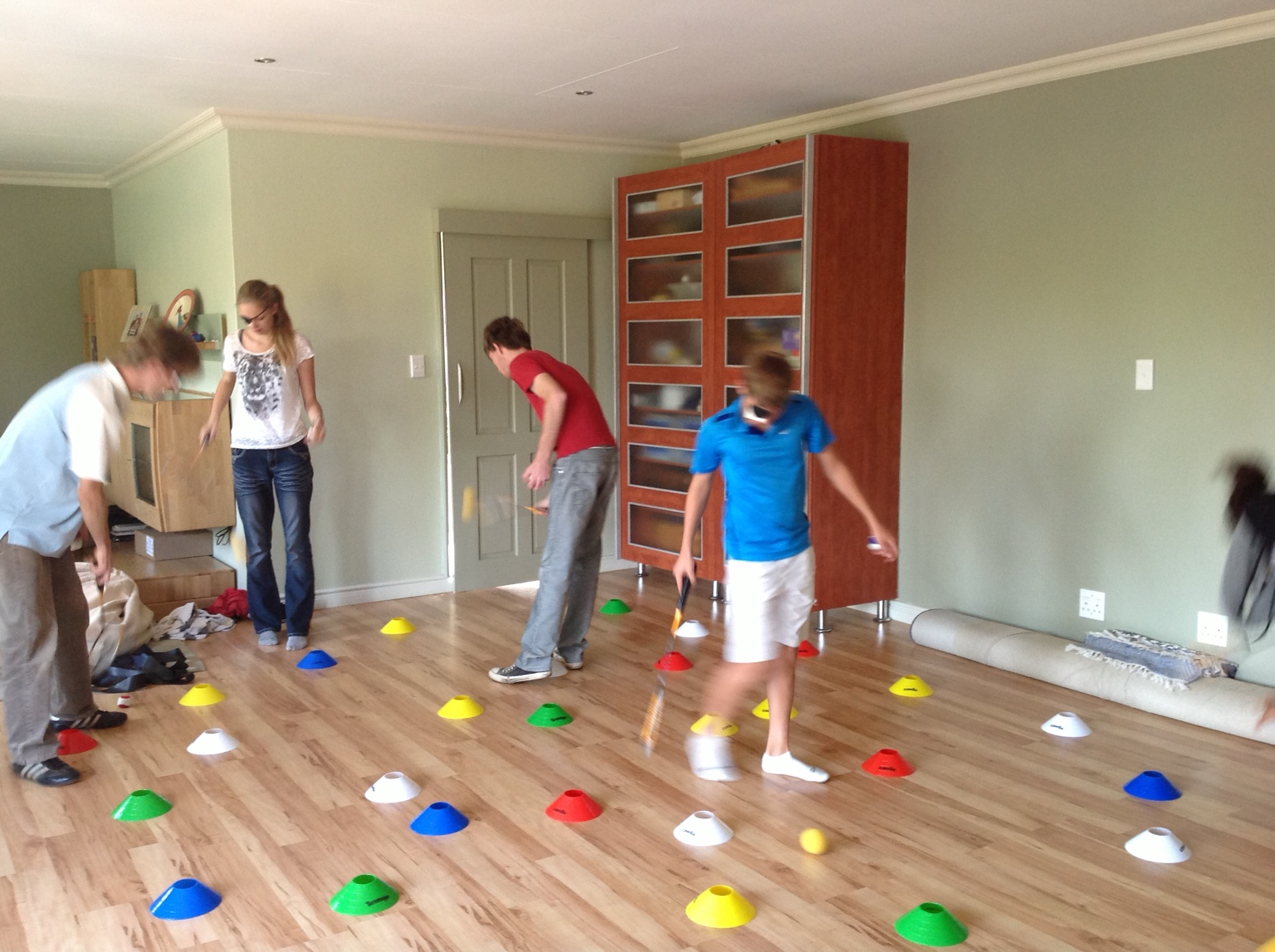 Children and adults completing a colourful Powerbrain coordination activity